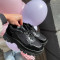   Melnas platformas botas